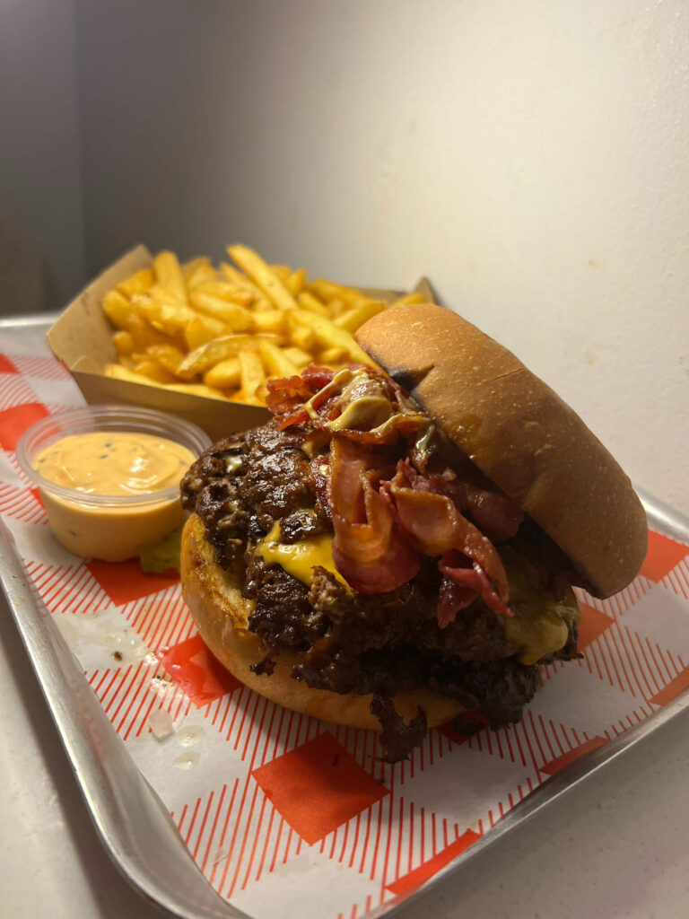 A burger, chips, and a dipping sauce at Dash Burger in Dublin.