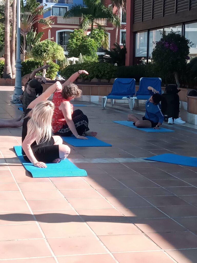 Sam doing yoga outside at the Bahia Principe Tenerife.