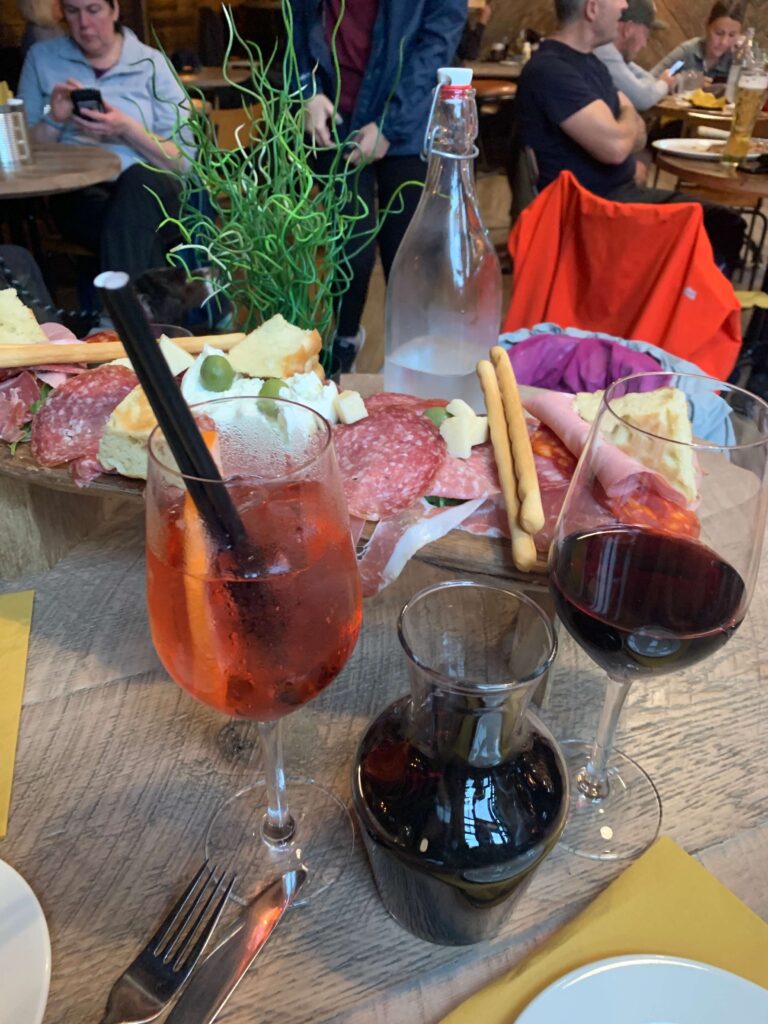 Antipasti board with wine and spritz