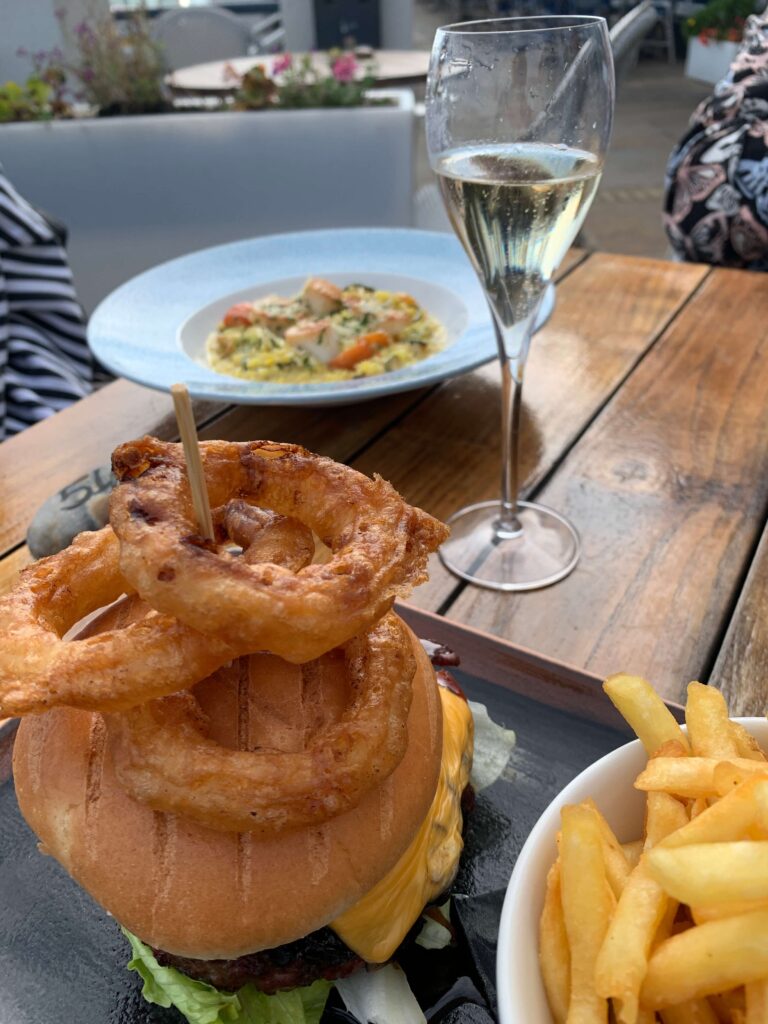 Burger, scallop risotto and glass of champagne
