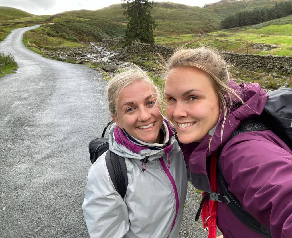 Two women walking taking a selfie