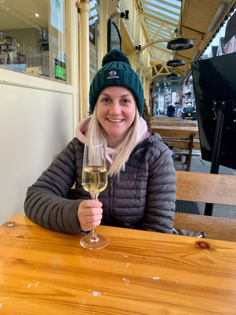 Blonde woman holding glass of champagne