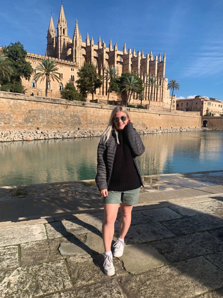 Woman standing in front of Palma Cathedral