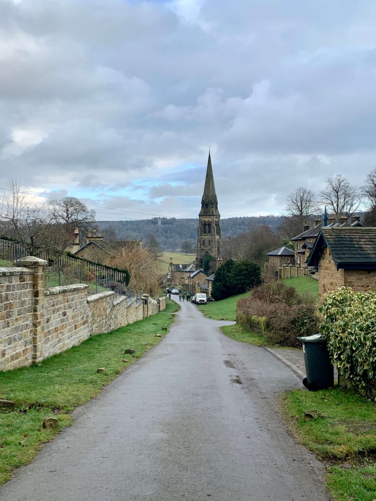 View of Edensor village church from up the road