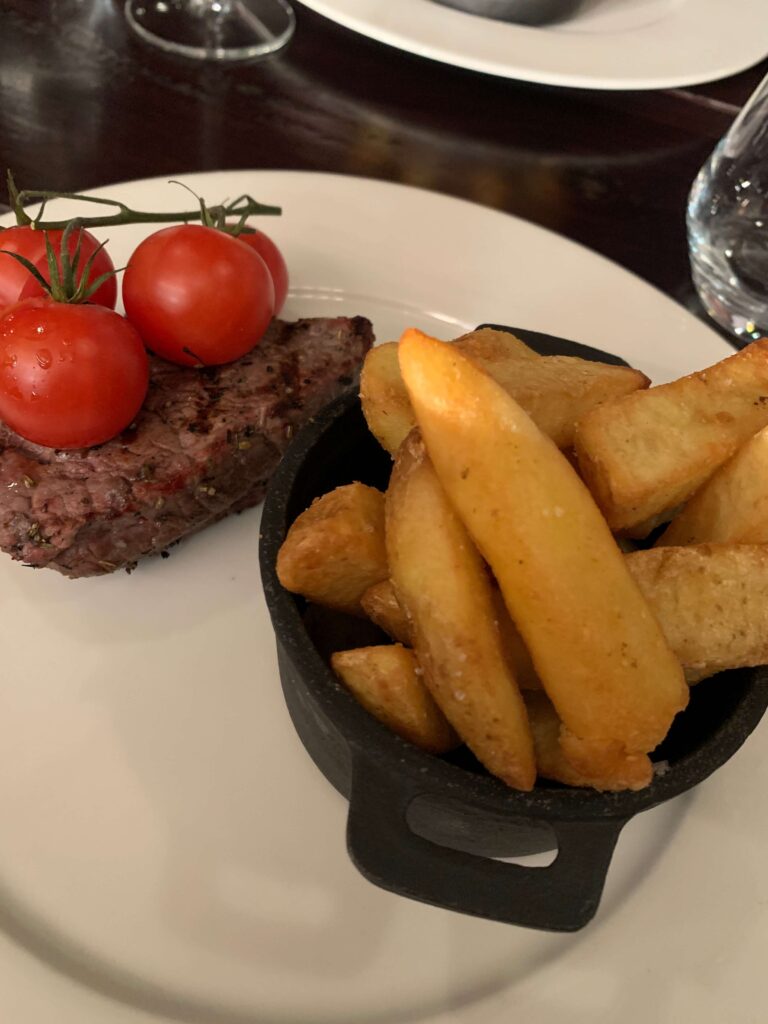 Fillet steak with chips and vine tomatoes