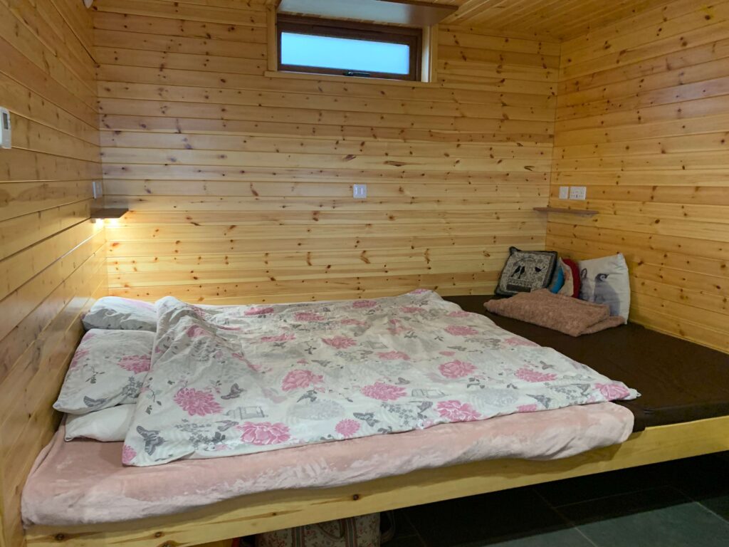 Sleeping platform with bedding and cushions