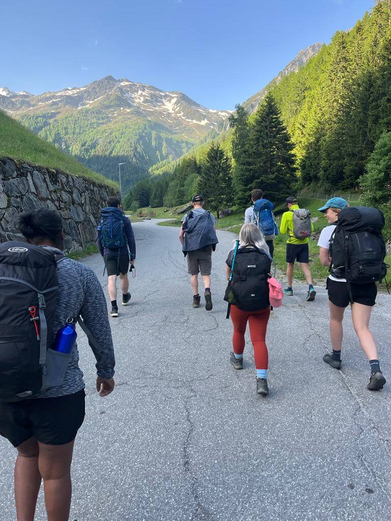 Group of people walking in the Swiss Alps