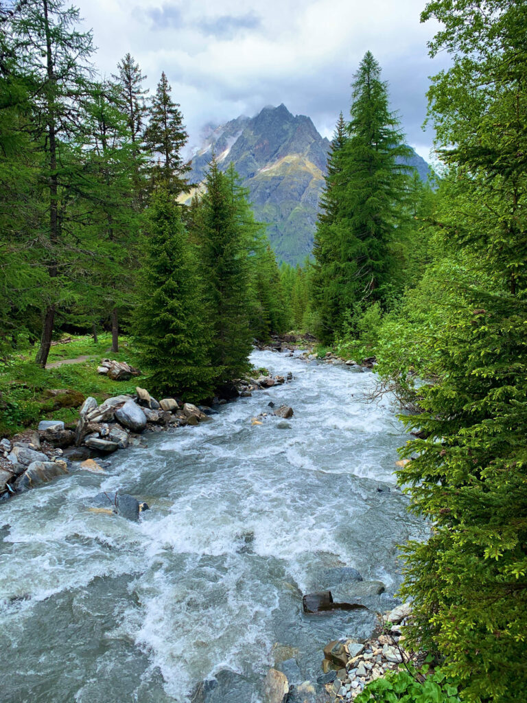 A river running in front of the mountains 