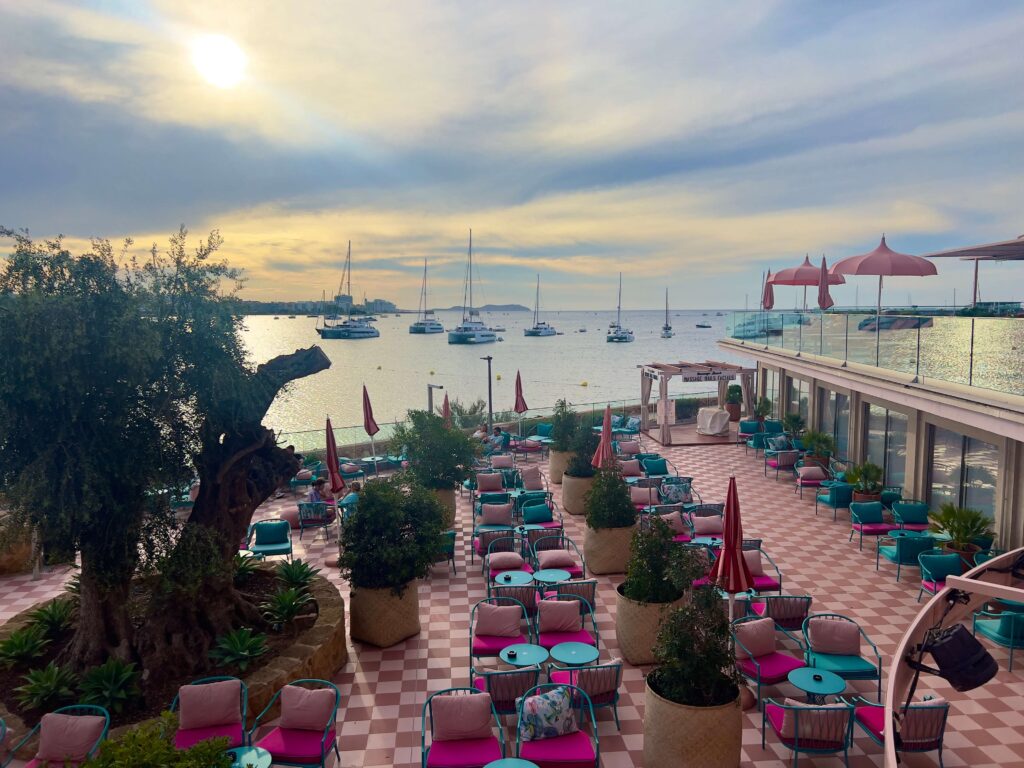 A view over the outdoor area at Hotel NYX Ibiza out over San Antonio Bay