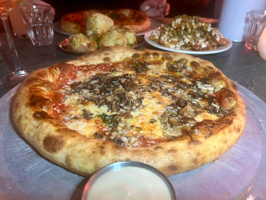 Pizza, dip, dough balls and loaded fries at Diecast in Manchester.