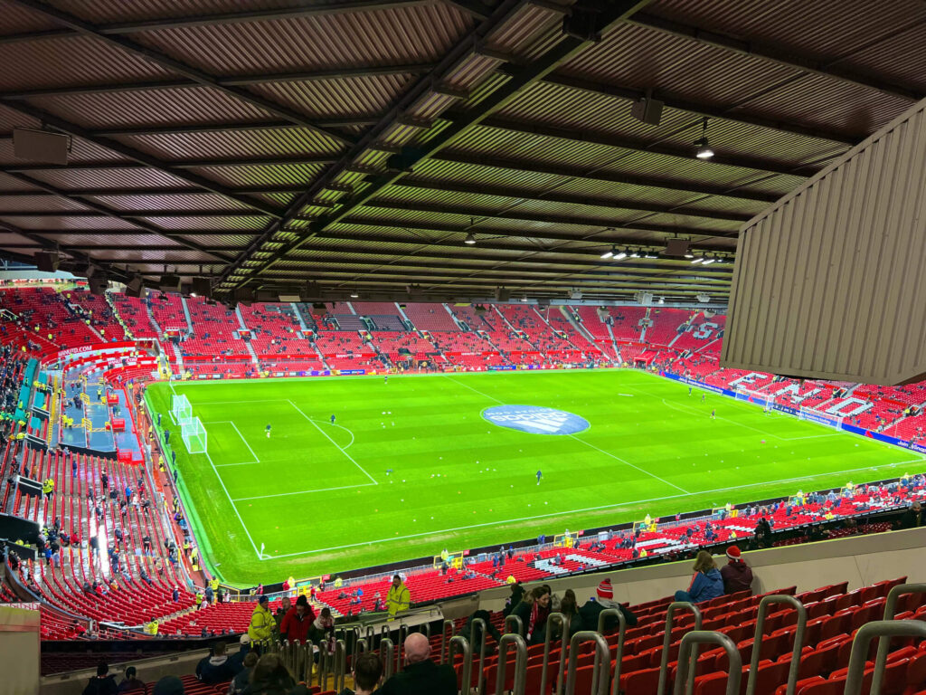 The view of the Old Trafford pitch from the top tier seats.