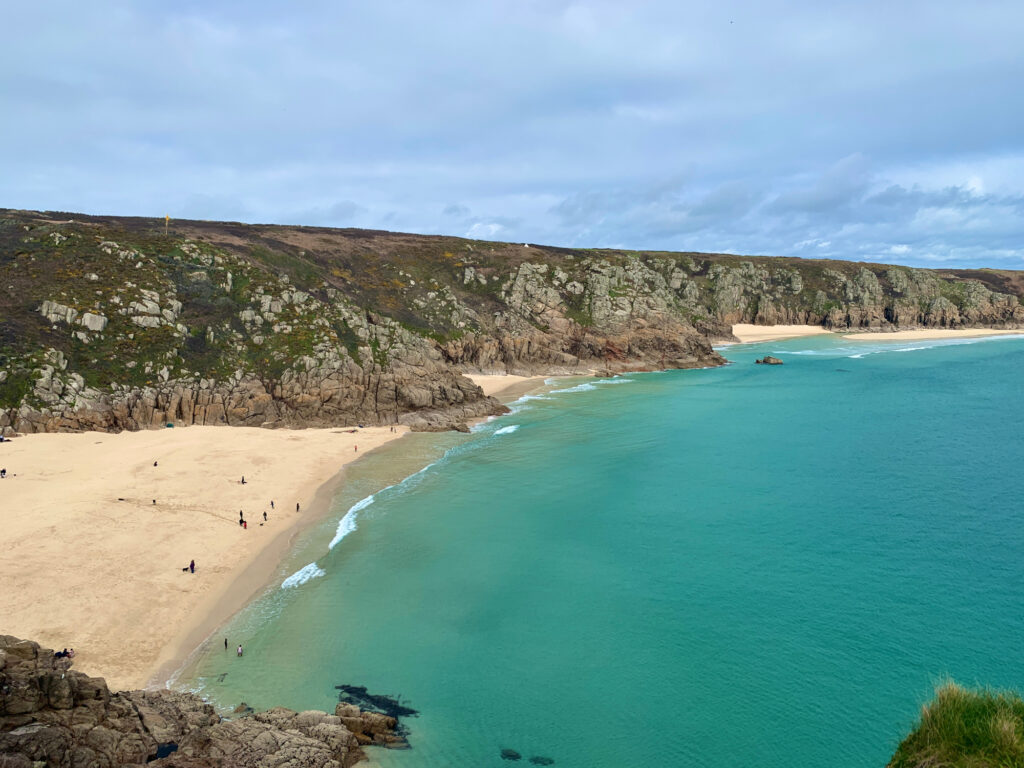 A view of Porthcurno beach from above.