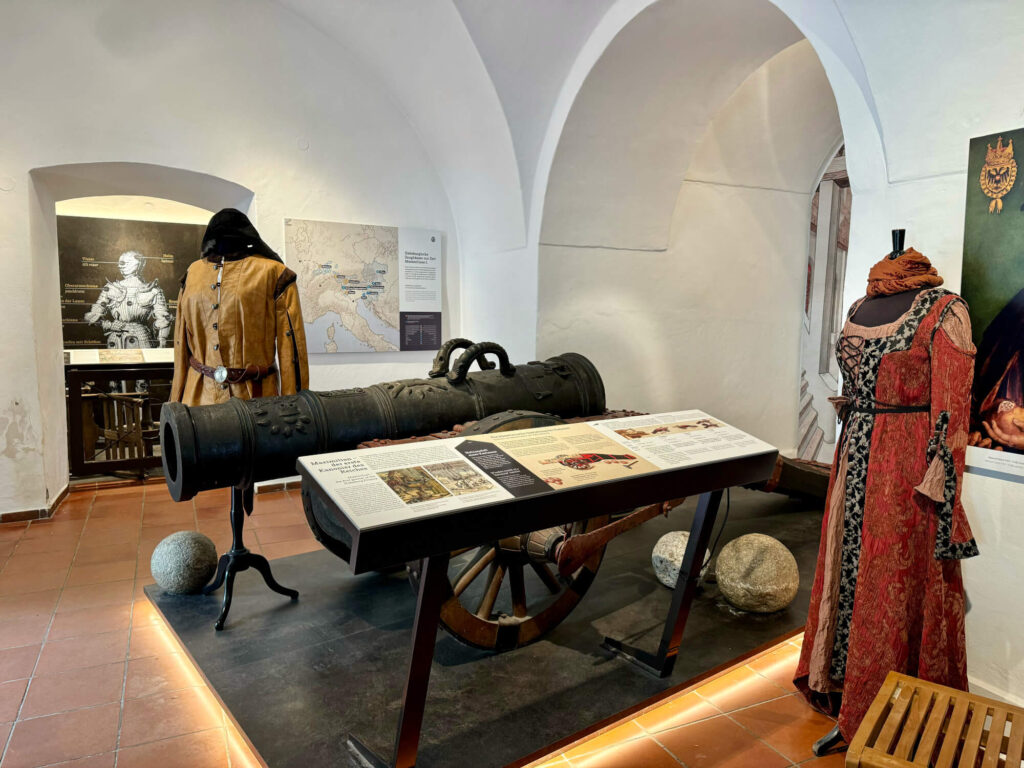 Traditional costumes and a canon inside the Kufstein fortress.