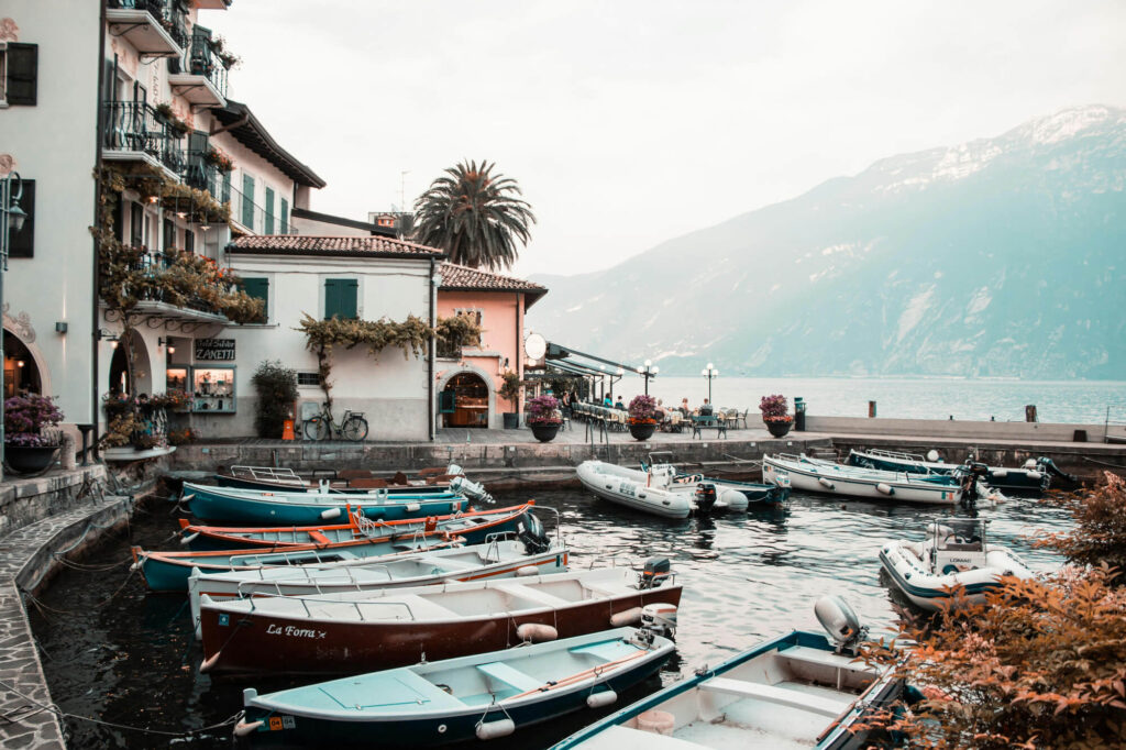 Boats and houses on the edge of Lake Garda.