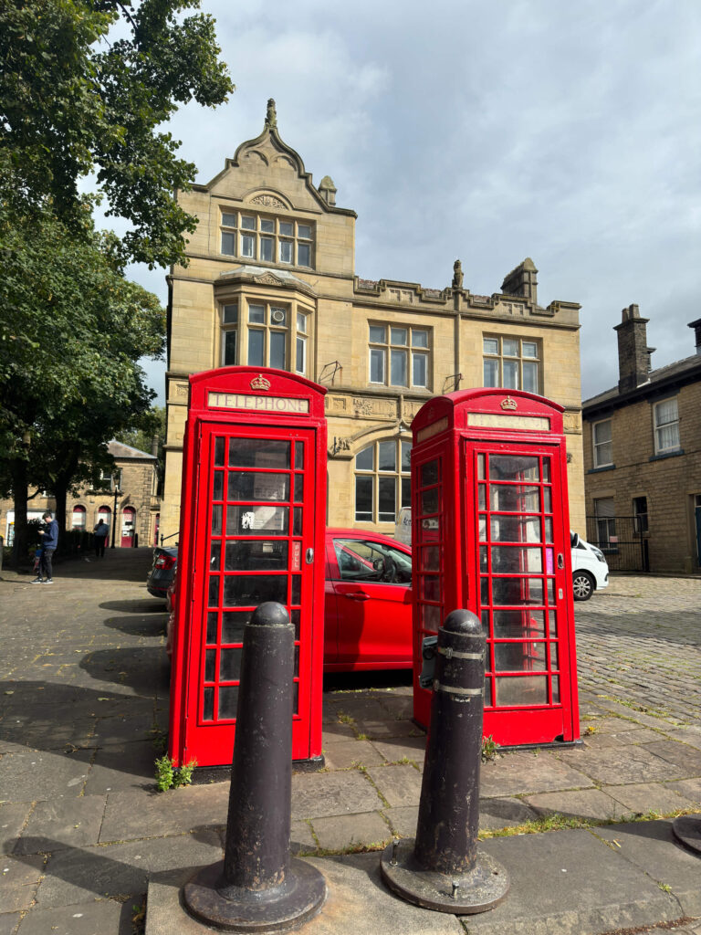 Two red phone boxes in Glossop.
