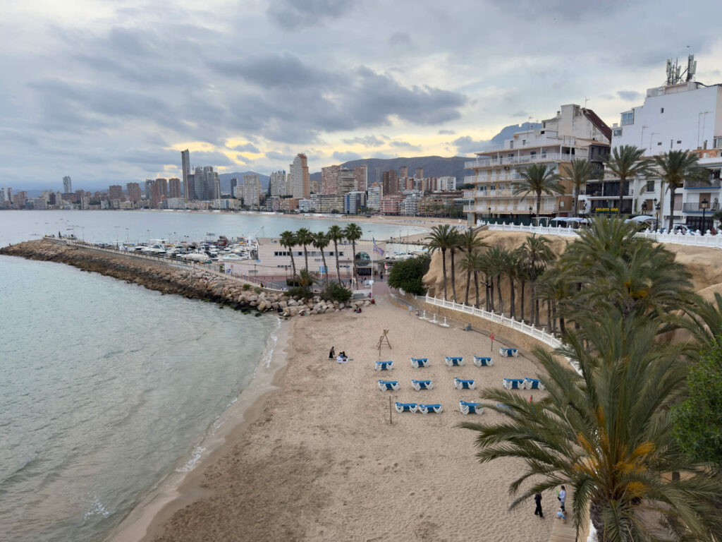 A view over the beach at Benidorm with skyscrapers in the background.