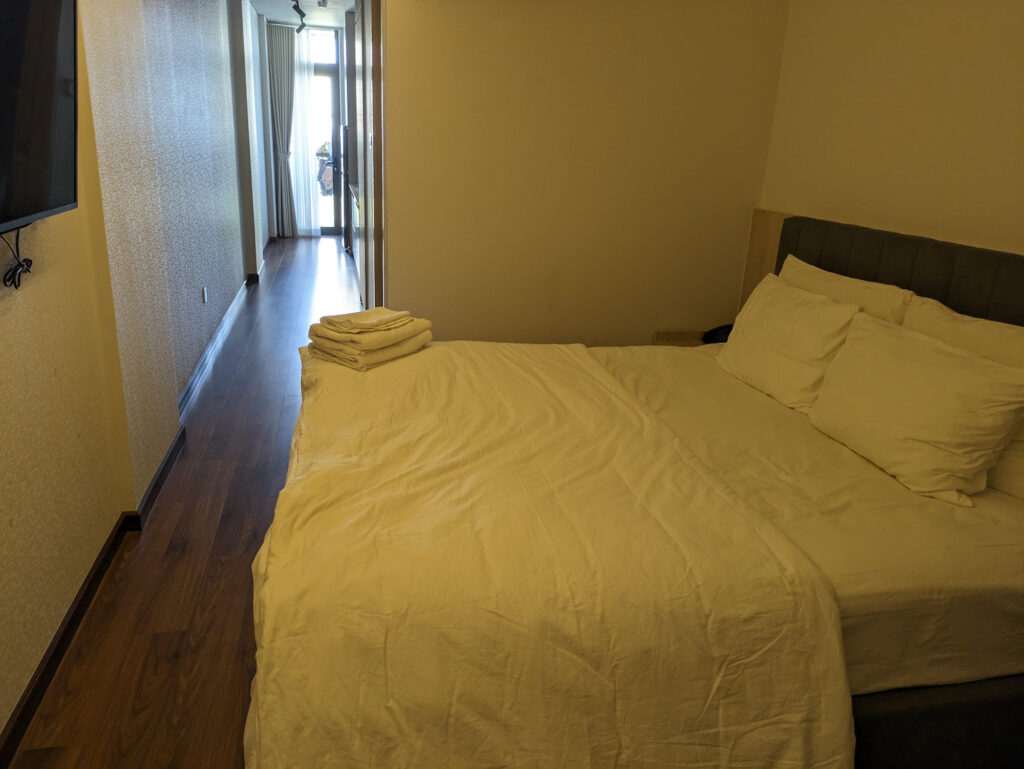A double bedroom at Tashi Ocean Hotel & Apartment.