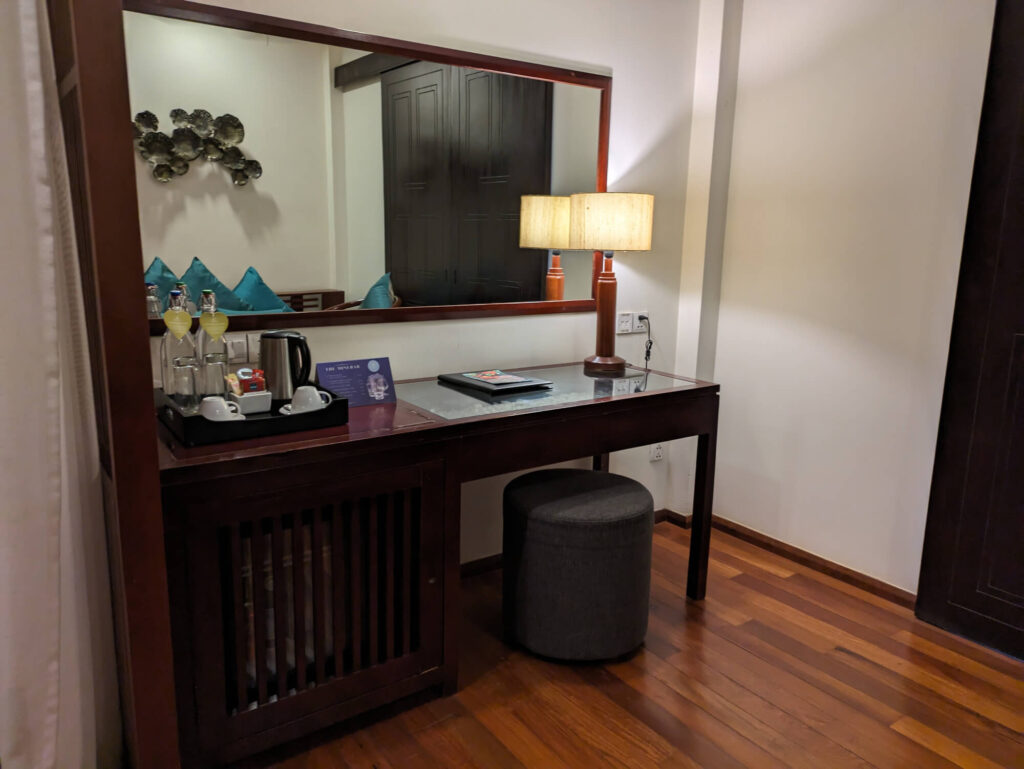 The dressing table and tea and coffee making station in one of the rooms at the Lotus Blanc Hotel.