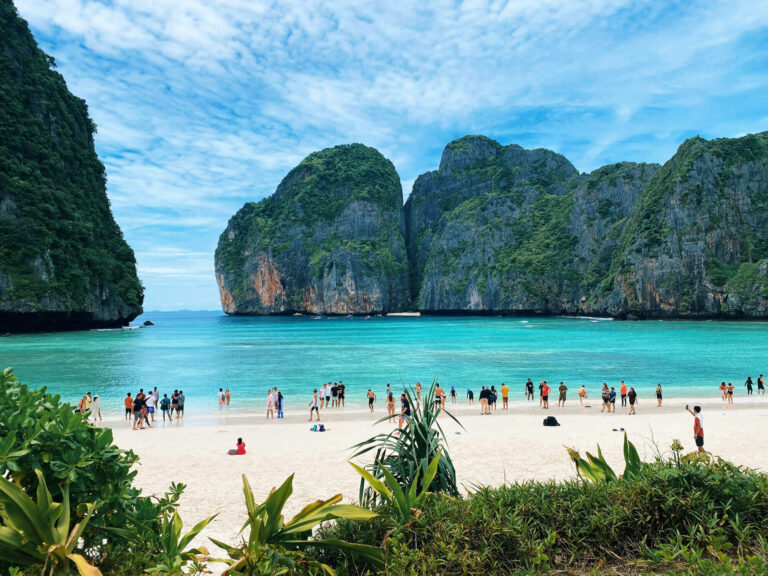 People gathering on a beach in Phuket, Thailand.