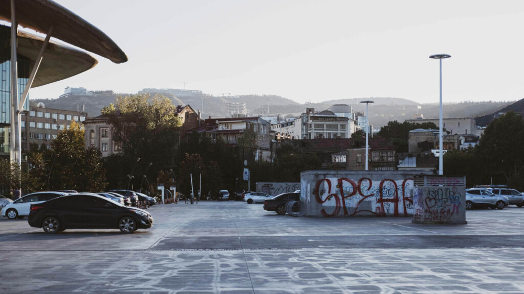 Cars parked in a car park in Tbiisi, Georgia.