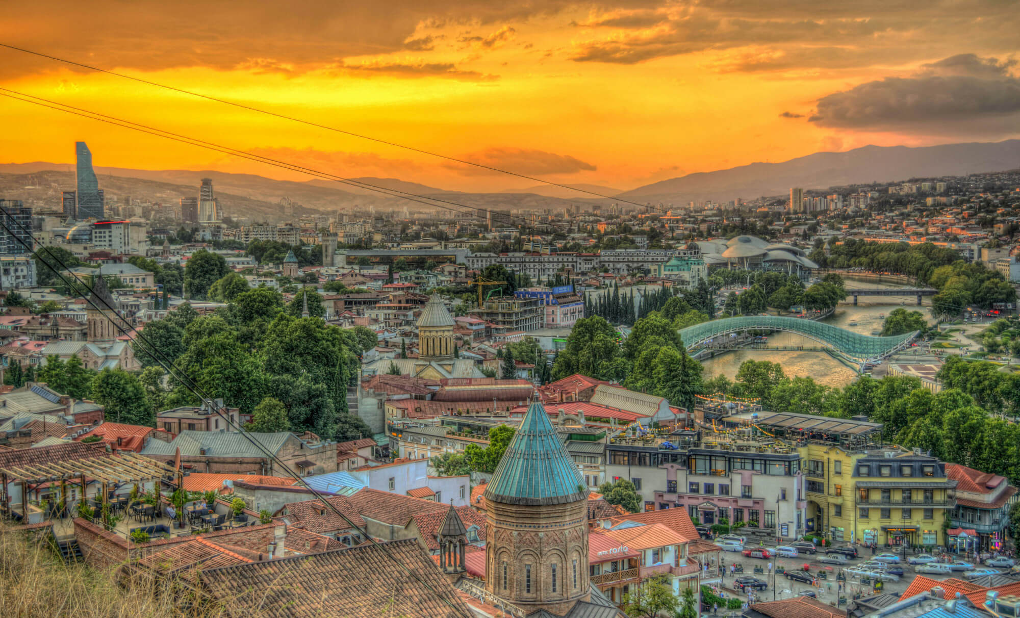 A view over the city of Tbilisi in Georgia at sunset.