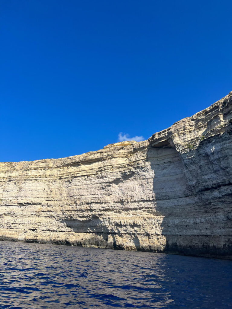 White cliffs and blue water at the Blue Lagoon in Gozo.